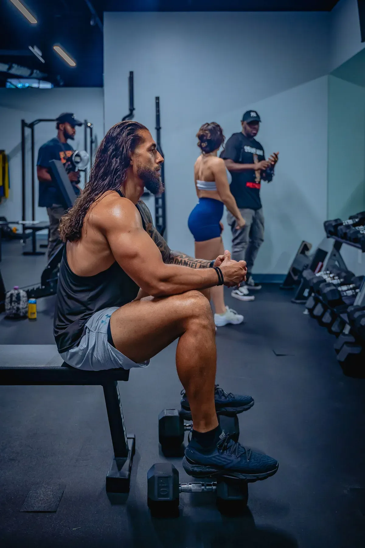 Members resting between sets in a small training studio